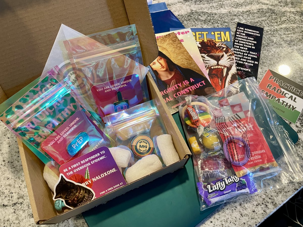 EcoPharmD's tweet photo. Y'all. I'm back on this hellsite because I wanted a naloxone pin and wound up adding more stickers &amp; pins to my cart, then this incredible box of radical public health swag shows up 😻 Going to post, I realize it's @clairezagorski- everyone needs to order from Pin Pen Merger! https://t.co/tbueYZy22i