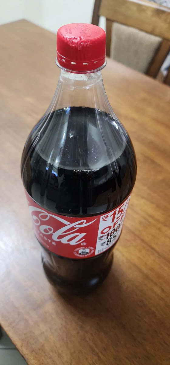 MathewCFranciz's tweet photo. I ordered a 2.25L coke bottle from @SwiggyInstamart yesterday and the cap was bitten by a rat. I raised a complaint and the support team said they will share feedback with the vendor but no refund. This is absurd. @Swiggy @BangaloreMirror @harshamjty https://t.co/n1rbirE8qr