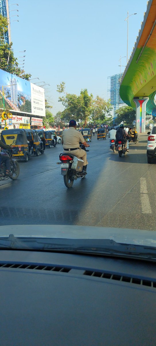 vikrant_thakkar's tweet photo. @ThaneTraffic hope rules are applicable to all ...cop driving without helmet https://t.co/E0CF5wEp0n