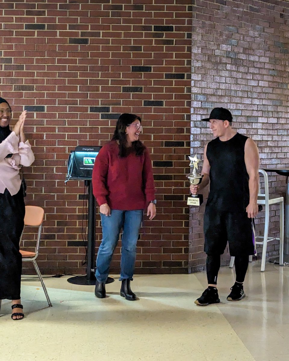 DeeringHS's tweet photo. At Deering, staff gathers weekly to award a star trophy, symbolizing appreciation. Recently, the custodial team received this honor, evoking unanimous gratitude. https://t.co/ktyeEOWeid