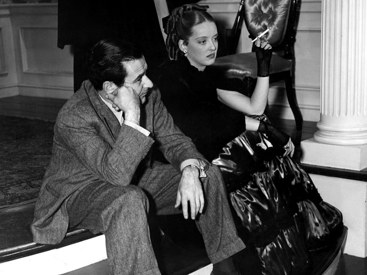 Bette Davis and director William Wyler on the set of JEZEBEL ('38) – their first of three films together.

Winning Best Actress for this film, Davis went on to receive an Oscar nomination for every project she worked on with Wyler.

See it this morning at 11am ET. #31DaysofOscar