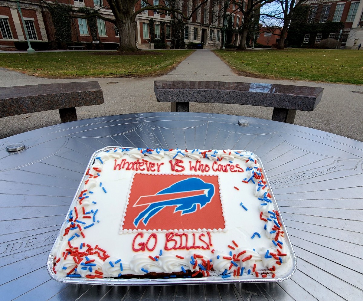 UofR's tweet photo. Whatever vs Who cares. Go Bills! ❤️💙 

(Enjoy the big game, Rochester!) https://t.co/4IuiEfFiZi