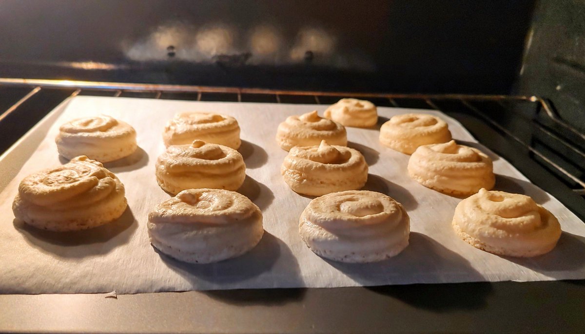 The French macarons were a big hit at work last week, so I made another batch for today. The egg whites weren't whipping up to stiff peaks and I almost tossed the batter, but they turned out really good. My piping skills suck and they're kinda wonky looking, but they taste good!