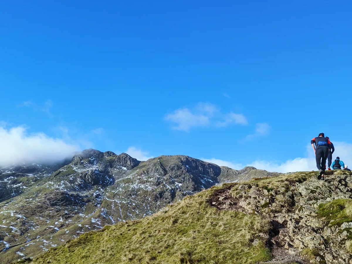 Blue skies over Langdale.for today's @amblesideac Sunday Social Club Run. The Band, Bowfell & Crinkle Crags. Signs of spring in evidence despite winter still clinging on up high.