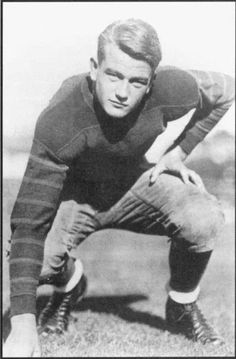 John Wayne, 1926 at USC.  His football career and college  scholarship ended with an injury from bodysurfing. He soon turned to acting working for the Fox Film Corporation, although stardom took another decade....