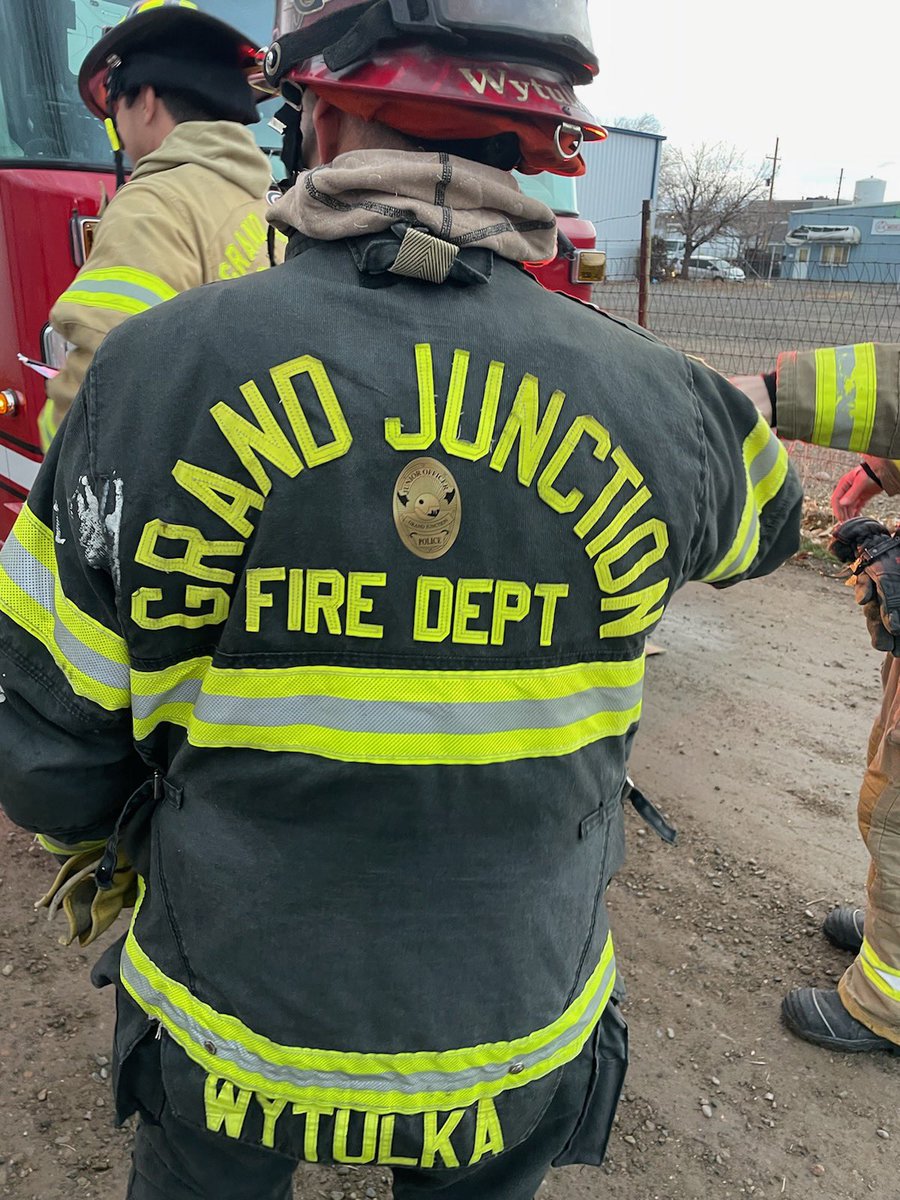 GrandJunctionPD's tweet photo. Officer Dressel wants to remind his buddy, Captain Wytulka, at @FireGJFD that he’s got his back. 😉 Shhh…let’s see how long it takes for the Captain to notice the cool #GJPD badge on his bunker gear. 

#servingGJ #TakingCareGJ #policevsfire #bestfriend https://t.co/rt90Pn8Pz4