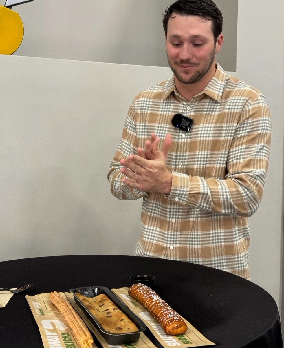 One Super Bowl Sunday I will watch my QB lead us to the pinnacle of the NFL and finally make us a city of champions. I truly believe it. Until that day comes I will settle for watching him prepare to take down a footlong churro, a footlong cookie log and a footlong pretzel stick