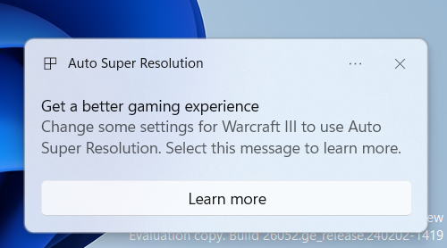 A notification in Windows 11 letting the user know that they can change some settings for the game "Warcraft III" to use Auto Super Resolution. A Learn more button is present in the notification.