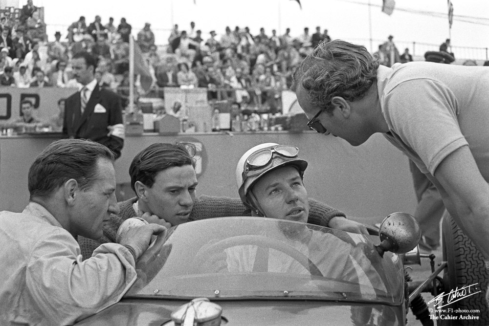 On February 11th 1934, the one and only John Surtees was born. Photo by Bernard Cahier: GP of Portugal 1960, John Surtees in the Lotus 18-Climax with which he set Pole Position, surrounded by Innes Ireland, Jim Clark and Colin Chapman.