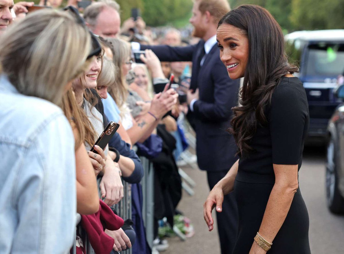 irenebritusa's tweet photo. Look how gracious the British people were despite being called racists. This was two weeks after that stupid Cut interview. The interview where she bragged about not signing a non disclosure agreement, saying:

“It’s interesting, I’ve never had to sign anything that restricts me from talking. I can talk about my whole experience and make a choice not to.” 

This was a threat in no uncertain terms and that’s how it was taken by many.  Then the Queen passed away ten days later.

Yet with all that, people were respectful, courteous and kind towards M. It was as if nothing had happened. It also demonstrated the love and respect they had towards the late Queen. William and Catherine knew people would be respectful too, or they wouldn’t have brought them on the walkabout.

So tell me again how the British people are racist and unwelcoming when they behaved so impeccably in M’s presence, even after all that had transpired. 

One minute she was the most popular royal of whom the others were jealous. The next she was reviled and hated because she’s ‘black’. Which one is it? It can’t be both.

Since The Cut and everything else, we’ve had Endgame where H&M’s mouthpiece accused the King — who walked M down the aisle — and Catherine of being the ‘royal racists’.  Not to mention digs such as referring to Catherine as a Stepford wife and the insults towards Queen Camilla. The self professed feminist still hasn’t denied co-signing the allegations. With all the public statements they bombard us with, they are silent on Endgame. 🤔

Harry told Bradbury that he never accused the RF of racism, “it was the British Press”. Then proceeded to gaslight the world and asked if M had ever accused them of racism. It was a little psychotic. 

When it suits them they are happy to cry racism, because victimhood is lucrative these days. But as soon as people have had enough of their whinging, they deny deny deny.

No wonder their fans are so confused.

The thing M failed to realize is that she was considered a member of the family. People don’t  typically deem it necessary to get loved ones to sign a non-disclosure agreement. But we know she doesn’t value family, She’s happy to sell her family out for money.  #defundracebaiting