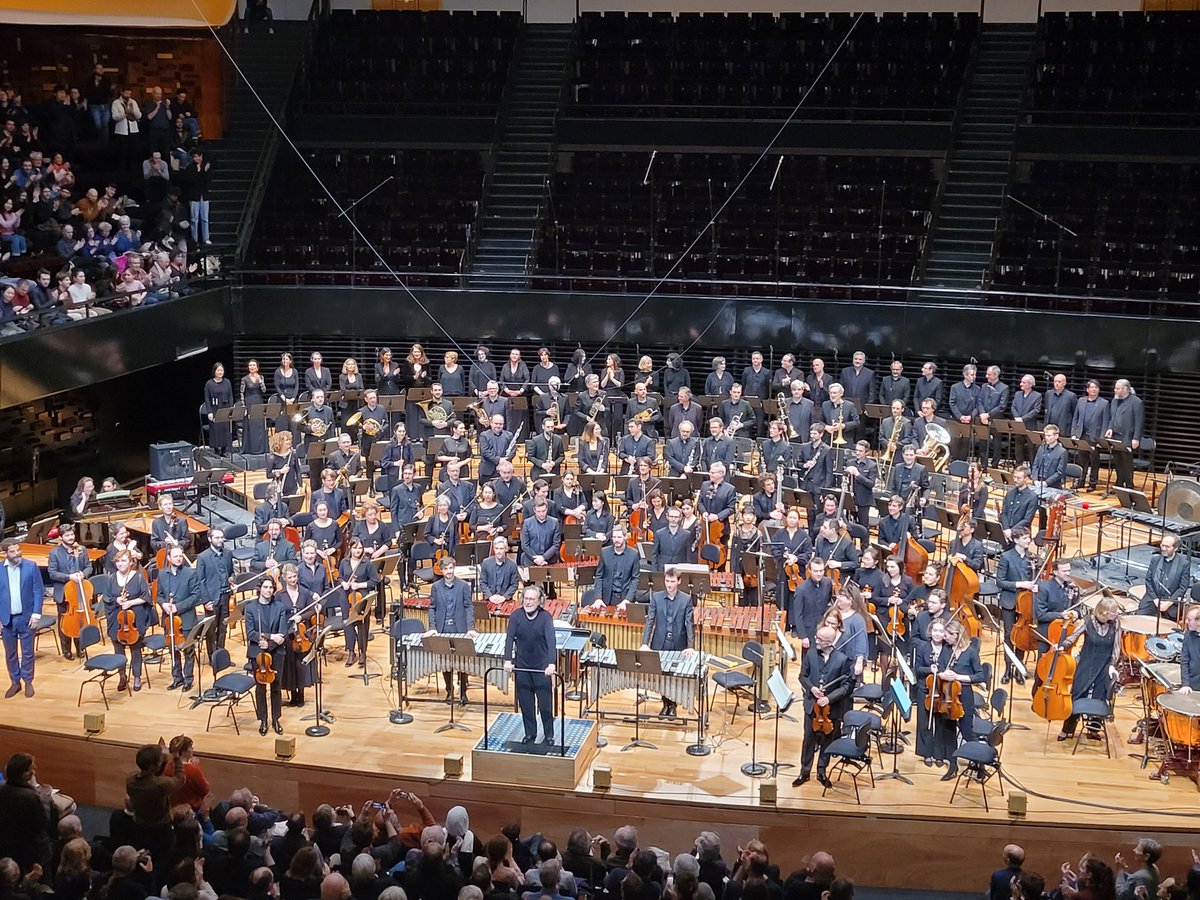 Brad Lubman, the Orchestre Philharmonique de Radio France, and Chœur de Radio France take a bow after performing Steve Reich's Desert Music, as part of Festival Presences weeklong Reich focus.