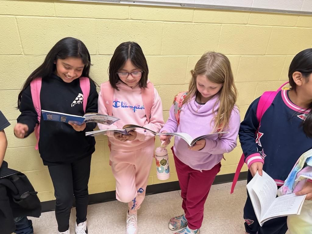 These 4th graders were "caught" reading in line to switch classes.  #dualschool