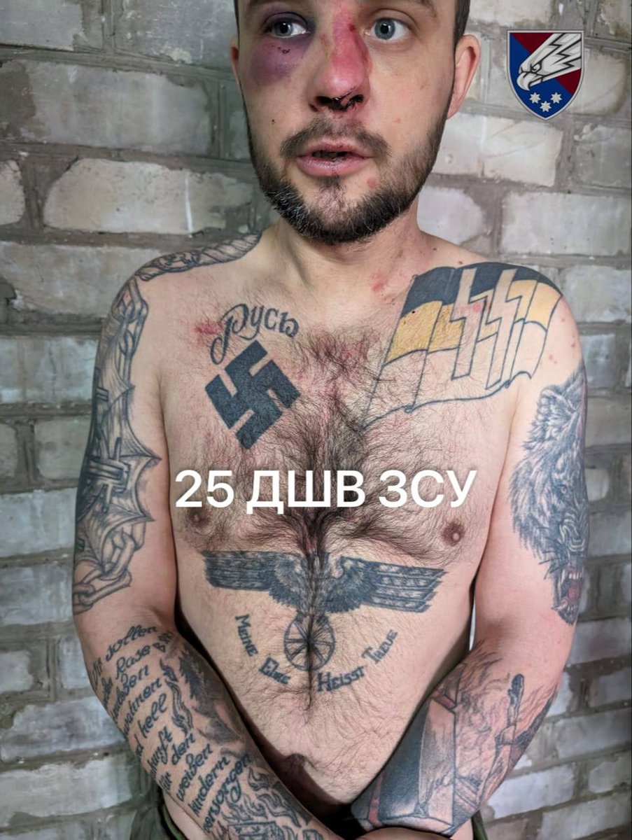 This is a russian POW very recently captured by the Ukrainian Armed Forces. The lettering above swastika says 'Rus' and yes, these are Nazi SS symbols on the russian imperial flag.
But, of course, according to putin the nazis are in Ukraine. Logic! 😊