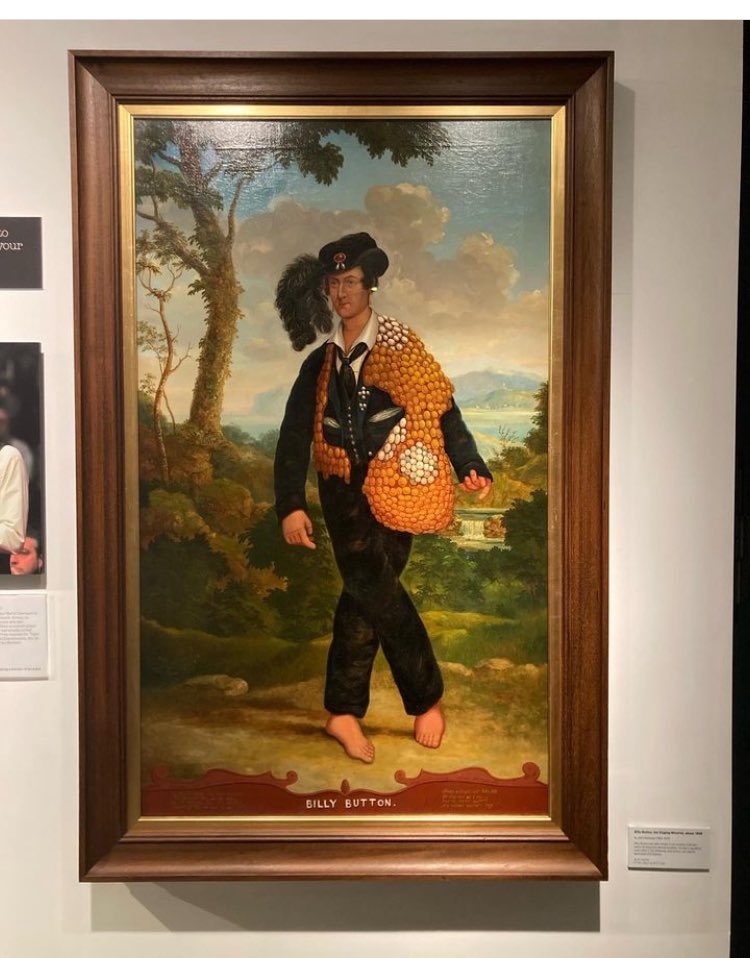 WeirdBristol's tweet photo. Billy Button (depicted here in a painting by John Dempsey in the M Shed collection) was a mid 19th century performer and eccentric who was known for dancing, singing and making music in the streets of Bristol - always barefoot and wearing his trademark coat festooned with buttons https://t.co/DxFEcxH1lx