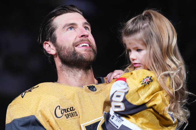 Alex Pietrangelo holds his daughter on the ice