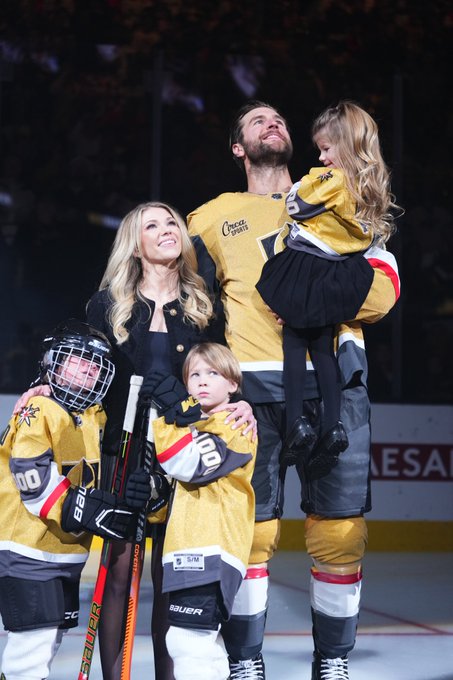 Alex Pietrangelo stands on the ice with his family