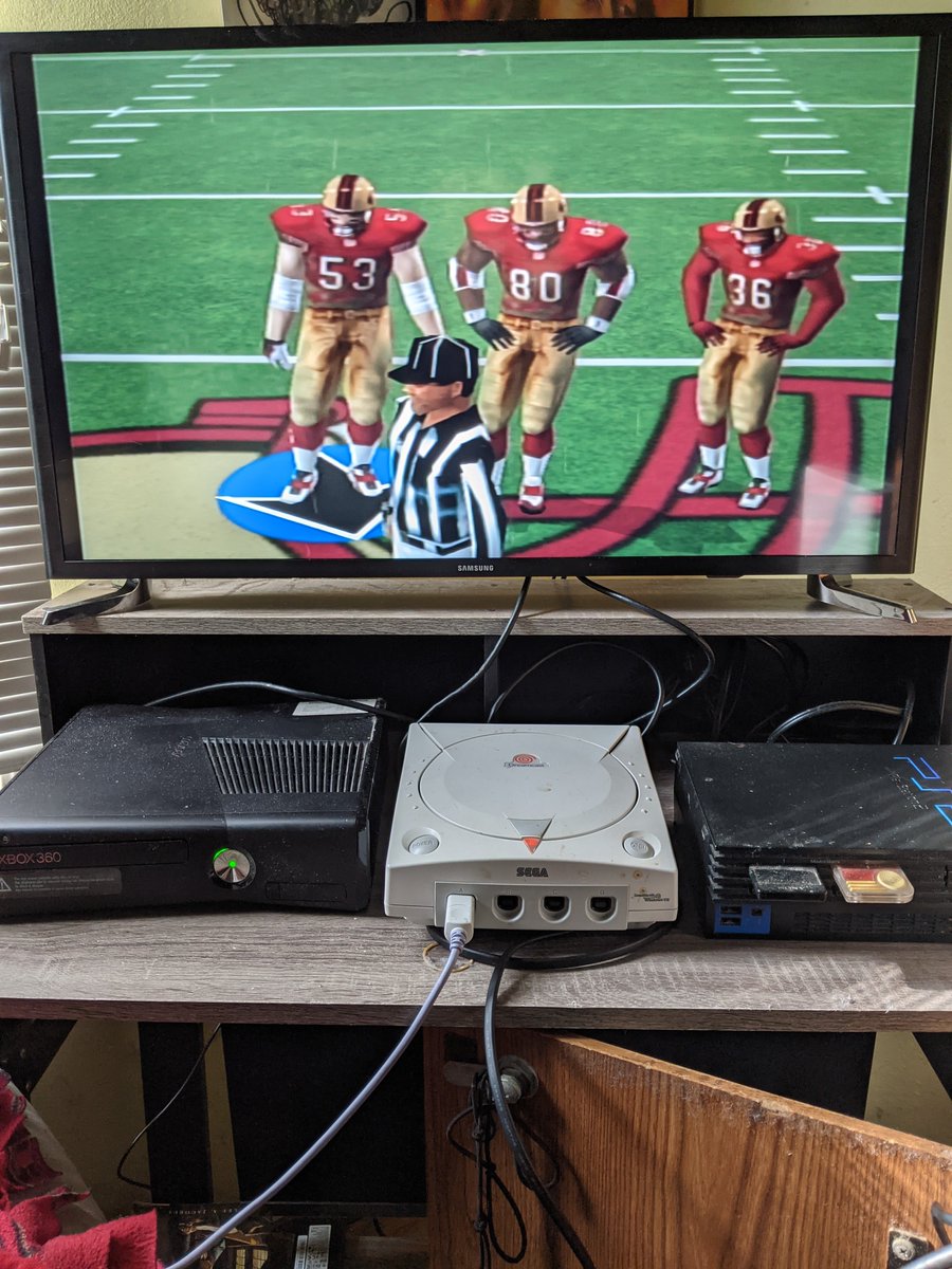 TreeFittyGaming's tweet photo. With all this time on my hands I dusted off some of my old consoles and setup an old school desk where my work would usual go. NFL2k1 Lol!! Sega Dreamcast! #oldschool #hellabored https://t.co/G0TtdnseDV