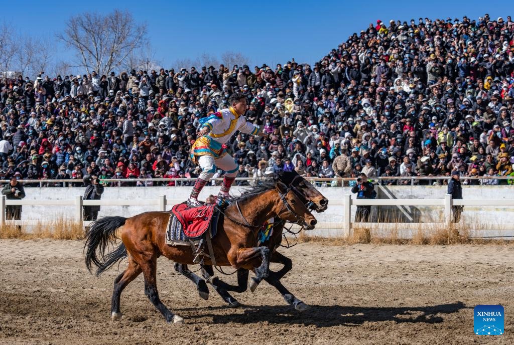 PDChina's tweet photo. Dressed in colorful Tibetan clothes, the equestrian team of southwest China's #Xizang Autonomous Region staged a thrilling display of traditional horse racing in its capital Lhasa on Monday, the third day of the Tibetan New Year. #HorseRacing https://t.co/LuAcuwseXW