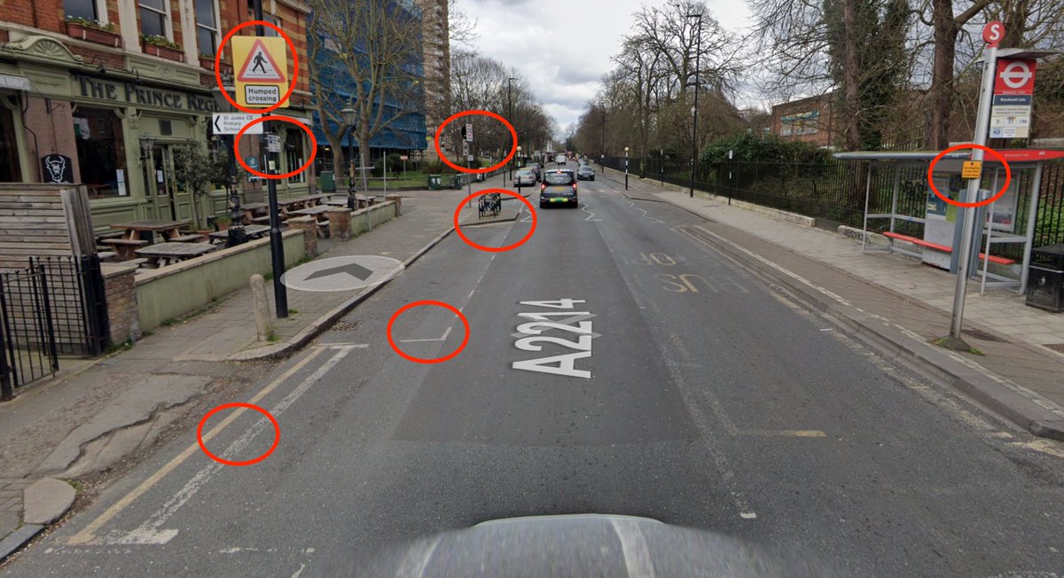 ColdWarCliff's tweet photo. The UK's streets are an ugly mess because we pander to drivers so much. Another sign or marking will make it better is the answer to everything. 
DYL/SYL, white line to mark crossovers, parking signs on every post.  20mph.  Slow. No stopping at any time on the bus stop... https://t.co/4JYVOldtgj