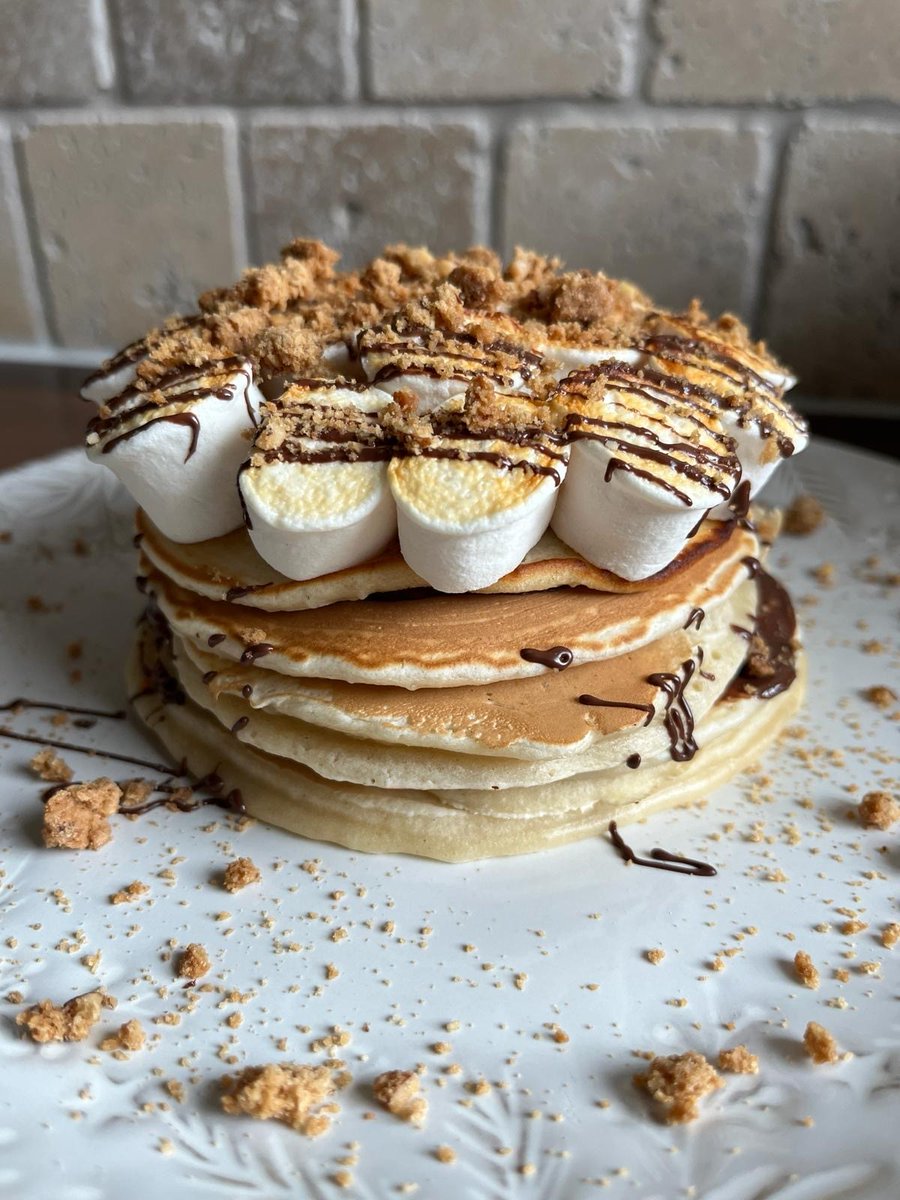 STOP WHAT YOU'RE DOING. Its pancake day and you need to make these toasted s'mores pancakes. They're unreal. The pancakes are sandwiched with melted vegan chocolate, topped with our toasted vanilla mallows, more melted chocolate and crumbled <a href="/Rhythm108/">Rhythm 108</a> almond biscotti biscuits.