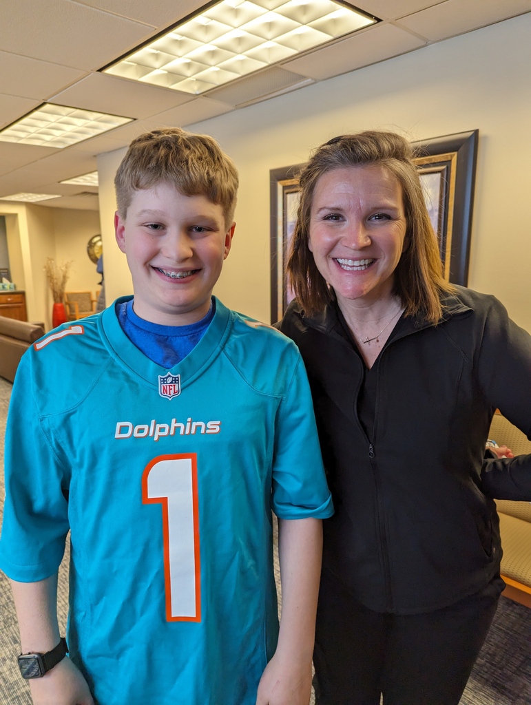 Bently just scored a touchdown in style! He got his braces on the other day, and the excitement was real. Guess what added an extra dash of awesome? He picked rubber bands to match his new favorite Dolphins jersey! Now that's what we call a winning smile strategy!