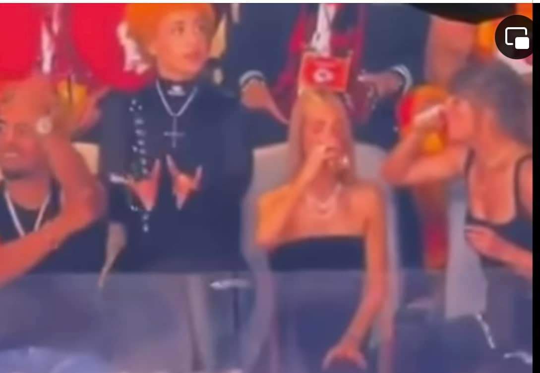 TerrencePerfect's tweet image. These people do it in your face. You will still drink the Kool aid and watch the events just like in ancient Rome. Girl throwing up Baphomet sign with an upside down cross, and with a Balenciaga attire on the side. They aren't hiding their Satanism it's in your face.