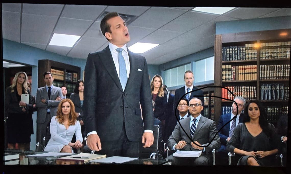 farhandhalla's tweet photo. Another day at Pearson Specter Litt! That’s me to the left of Meghan Markle #Suits #SuitsUsa https://t.co/peB9MMYzZm