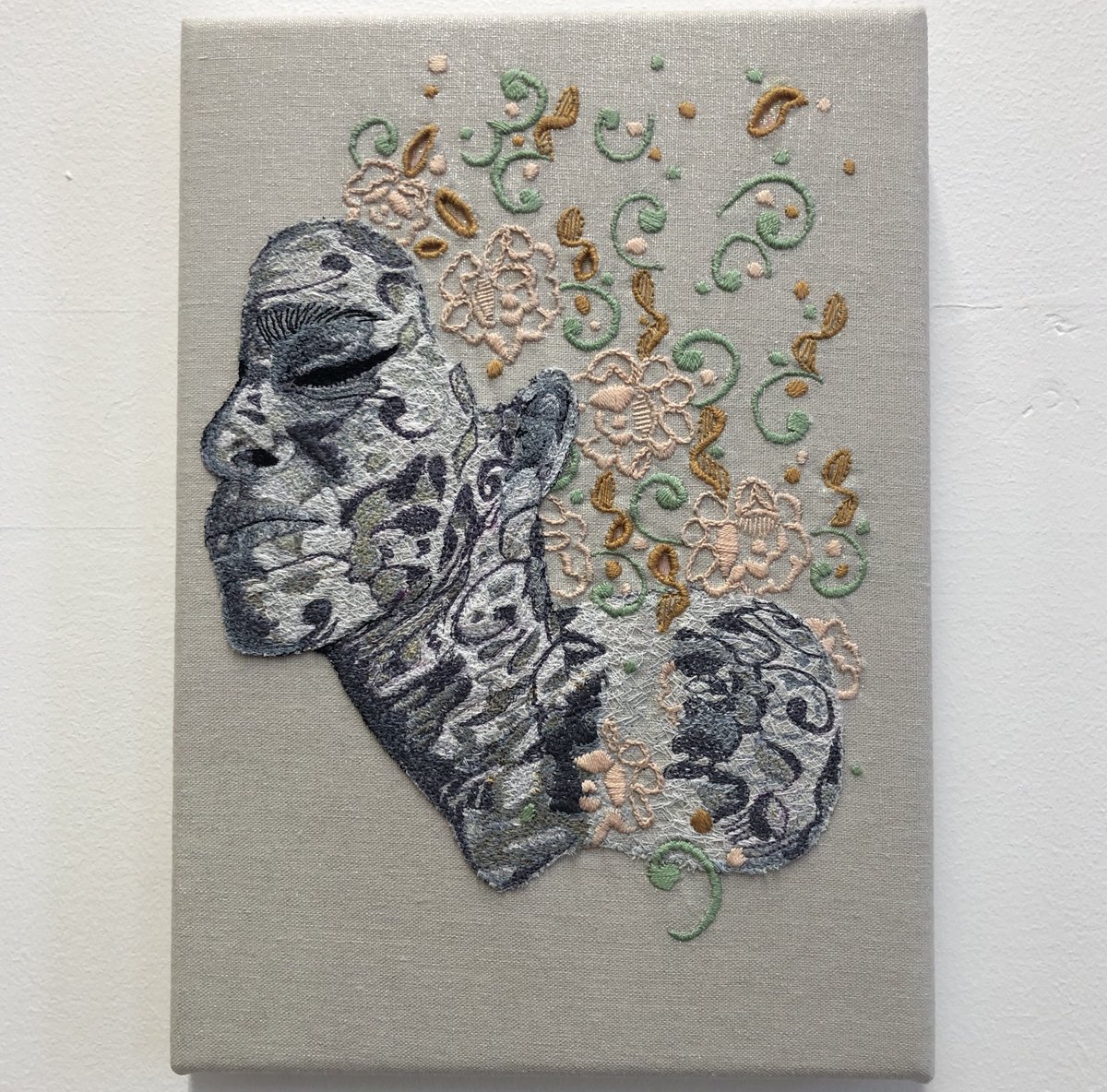 PootlesMoon's tweet photo. ‘Absorbed’ - self-portrait taken from a photo in 2020, stuck at home and making play with sunshine and lace in the garden🌞 Trying out @aurifil new 8wt cotton thread, being launched at QuiltCon next week, where this artwork will be exhibited for the first time 😊 
#embroidery https://t.co/YCjNLMEREe