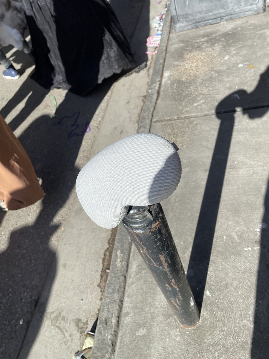 JustinMapes's tweet photo. Someone left their Apple Vision Pro cover on Royal street on Mardi Gras day. Looked down and it was just laying in the street so I stuck it on this post. #AppleVisionPro https://t.co/U0m618P9RM