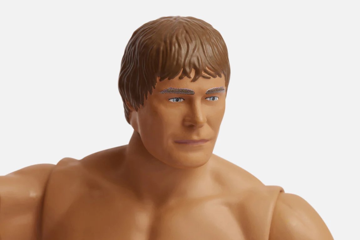 Jilko's tweet photo. It’s amazing how a very plastic action figure looking merch item from A24 looks EXACTLY how Zac Efron’s face looked like in The Iron Claw. They captured the uncanny valley perfectly here. Bravo. https://t.co/HcJ2JjNtOs