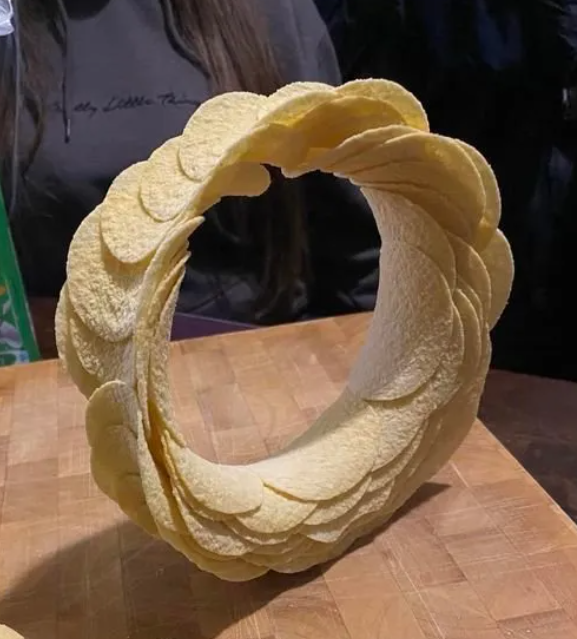 Bored father and daughter create a Pringle masterpiece. I present the 'Ringle'. #wtf #willpower #thingofbeauty