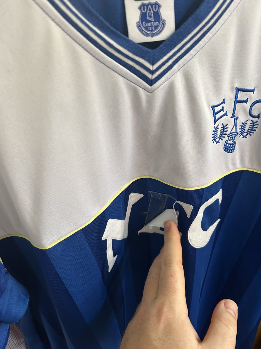 SimonTibke's tweet photo. @Scoredrawretro very disappointed with this product. Was bought it as a gift, worn and washed twice as per instructions and it’s all peeling off?! 🤷🏼‍♂️ can you help? Also it’s not just a case of iron on the reverse to re-stick, these letters have come apart! https://t.co/uMn5GtX74l