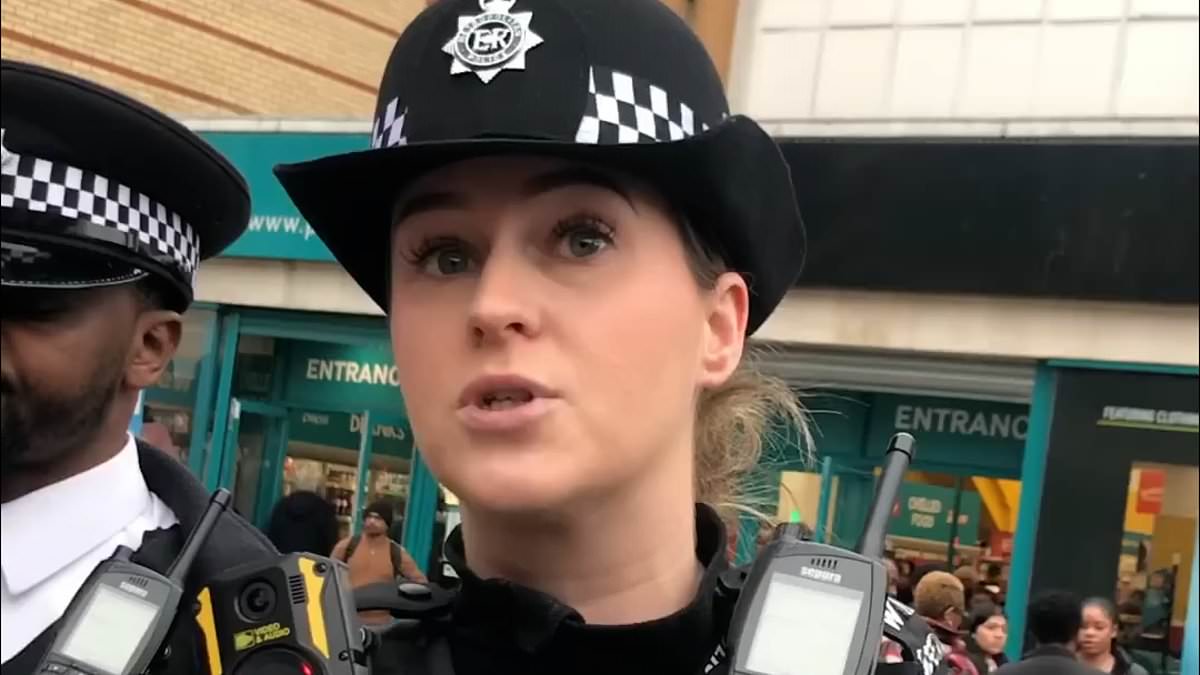 DailyMail's tweet photo. Met Police threaten to arrest ANOTHER Christian in London: Officer is seen in stand-off with gospel preachers https://t.co/DO7SHgYVn2 https://t.co/3UjhMYzcoM