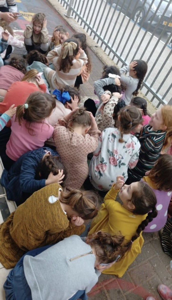 visegrad24's tweet image. Israeli kindergarten children taking cover during the Hezbollah rocket barrage against Safed an hour ago that killed 1 and wounded 9