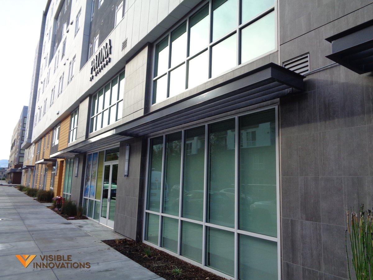 We designed and installed these sunshades, adding style and sun protection to this new building.