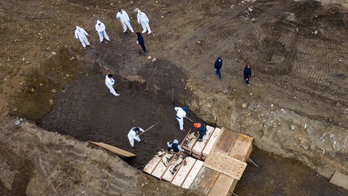 Americans have forgotten the mass burial pits where Covid victims were interred, here in America. This picture is from April of 2020. We've forgotten the refrigerator trucks used as temporary morgues to store bodies outside hospitals. And Trump is running for president again.