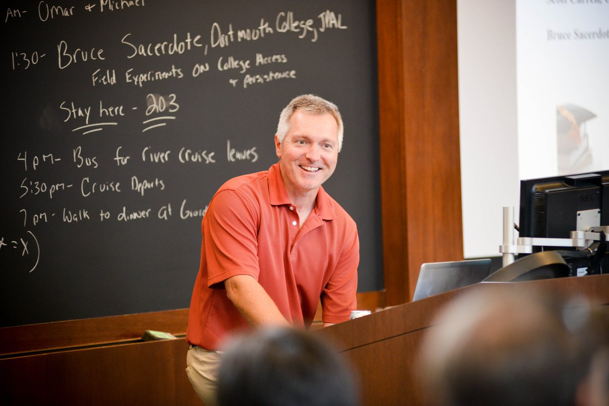 Professor John A. List giving a lecture in front of a chalkboard
