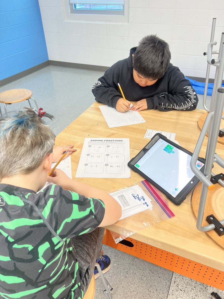 RachN635's tweet image. 5th grd Ss #solving adding and subtracting of #fraction problems to find the #code cards with the correct blocks of code to program @WonderWorkshop #DASH #robot to move, dance, and sound just like the teacher’s Dash #STEM #math @MCSDigital @MooreSchools