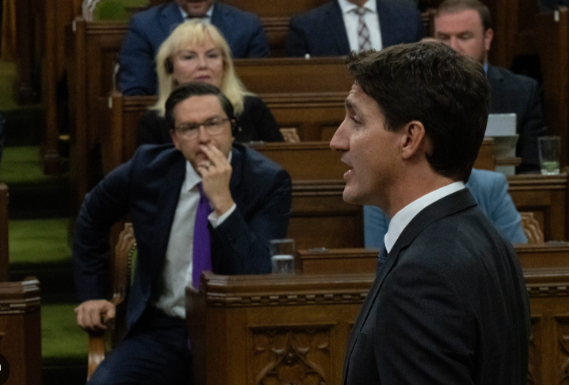 chuckjohns's tweet photo. @liberal_party Add in Creepy PP's habit of obsessively staring at Trudeau. #StalkerStatus https://t.co/b5pfniwy9i