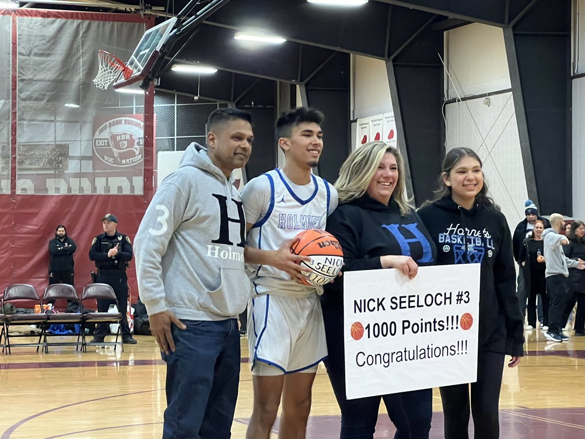 Nick Seeloch celebrates his 1000th point for Holmdel, then it’s back to business.