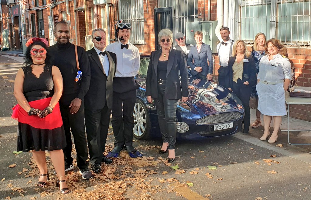 VickiTreadell's tweet photo. Last night our @DefenceAust @ukinaustralia team hosted the annual Canberra #Defence Attachés party.
The theme - #Bond, #JamesBond. There were several Qs, Miss Moneypennys, Oddjobs & Blofelds &, of course, #007s.
The team & I with an @astonmartin just before our guests arrived. https://t.co/fqP0UCpOHY