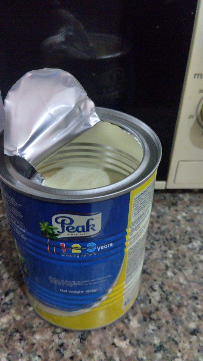 och_66's tweet photo. This is outrageous!!! I bought this peak 123 at a store at N3,550 which is N1,000 more than I bought it in November, opened this and saw the content slightly above half. This doesn't make sense! https://t.co/hbtBKJp89e