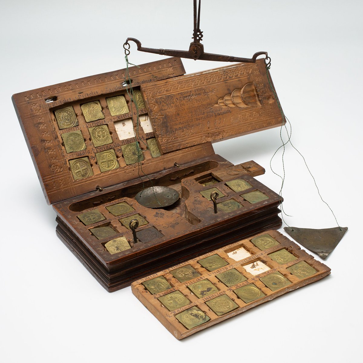 It’s all about balance! Balances were used to check the weight of medieval coins. A coin would be placed in the balance’s flat triangular pan, while a brass piece, equivalent to the coin’s standard weight, was set in the round pan.
