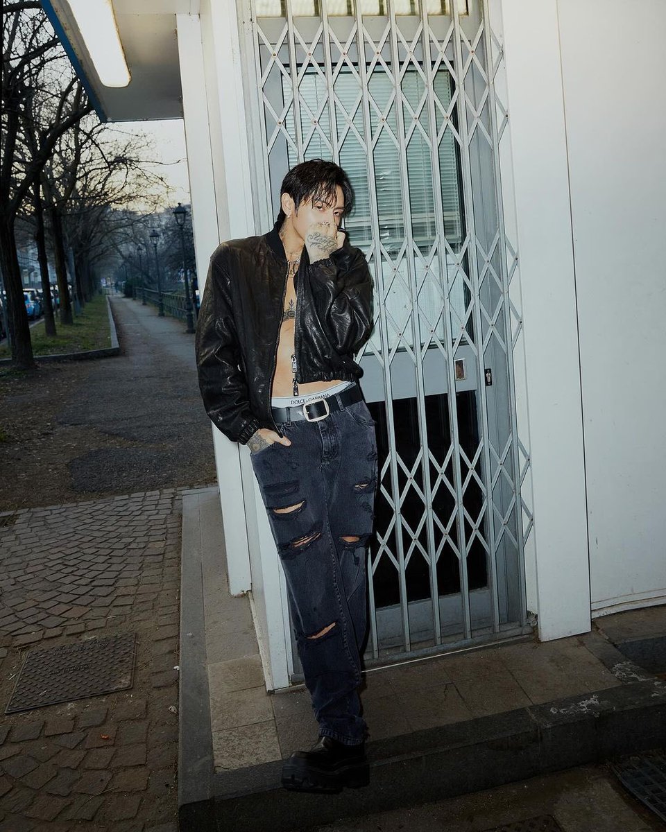 In solitude, amidst the tranquil embrace of an empty roadside, I find myself enveloped by the humble charm of diminutive structures that dot the landscape.