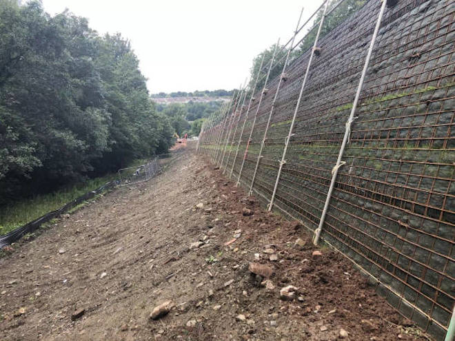 Textomur slope design from <a href="/phiretaining/">Phi Group</a> for road and path widening scheme ow.ly/MTAX50Qz8Wr #SlopeDesign #CivilEngineering #RetainingWall