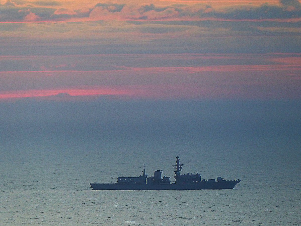 Type 23 frigate @HMSIronDuke seen at anchor in Tor Bay at sunrise this morning. She left the bay just before 8, and is currently on her way into Devonport Naval Base.