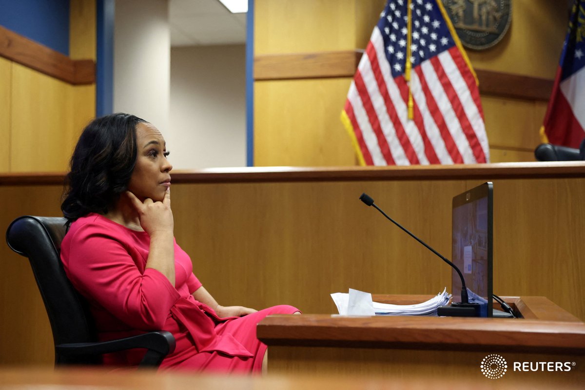 Attorney Fani Willis takes the stand as a witness during a hearing in the case of State of Georgia v. Donald John Trump at the Fulton County Courthouse in Atlanta, Georgia. Photo by @APointerPhoto