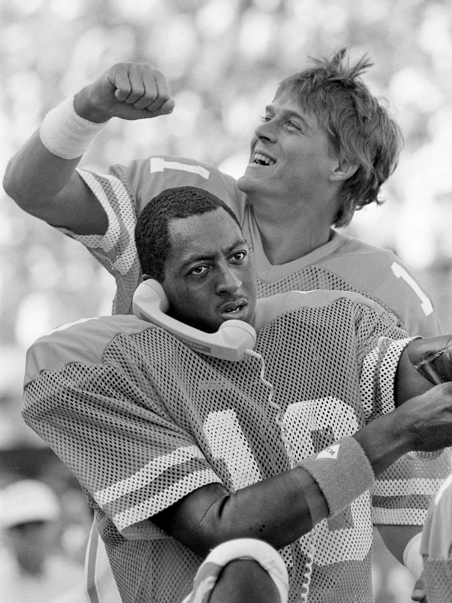 NeylandPress_'s tweet photo. Tennessee quarterback Tony Robinson talks from a sideline phone with assistant coaches in the press box as backup Daryl Dickey celebrates during the Volsโ 38-20 win over No. 1 Auburn on Sept. 28, 1985 at Neyland Stadium.
๐ธ The Tennesseean https://t.co/X9sw4JLyix