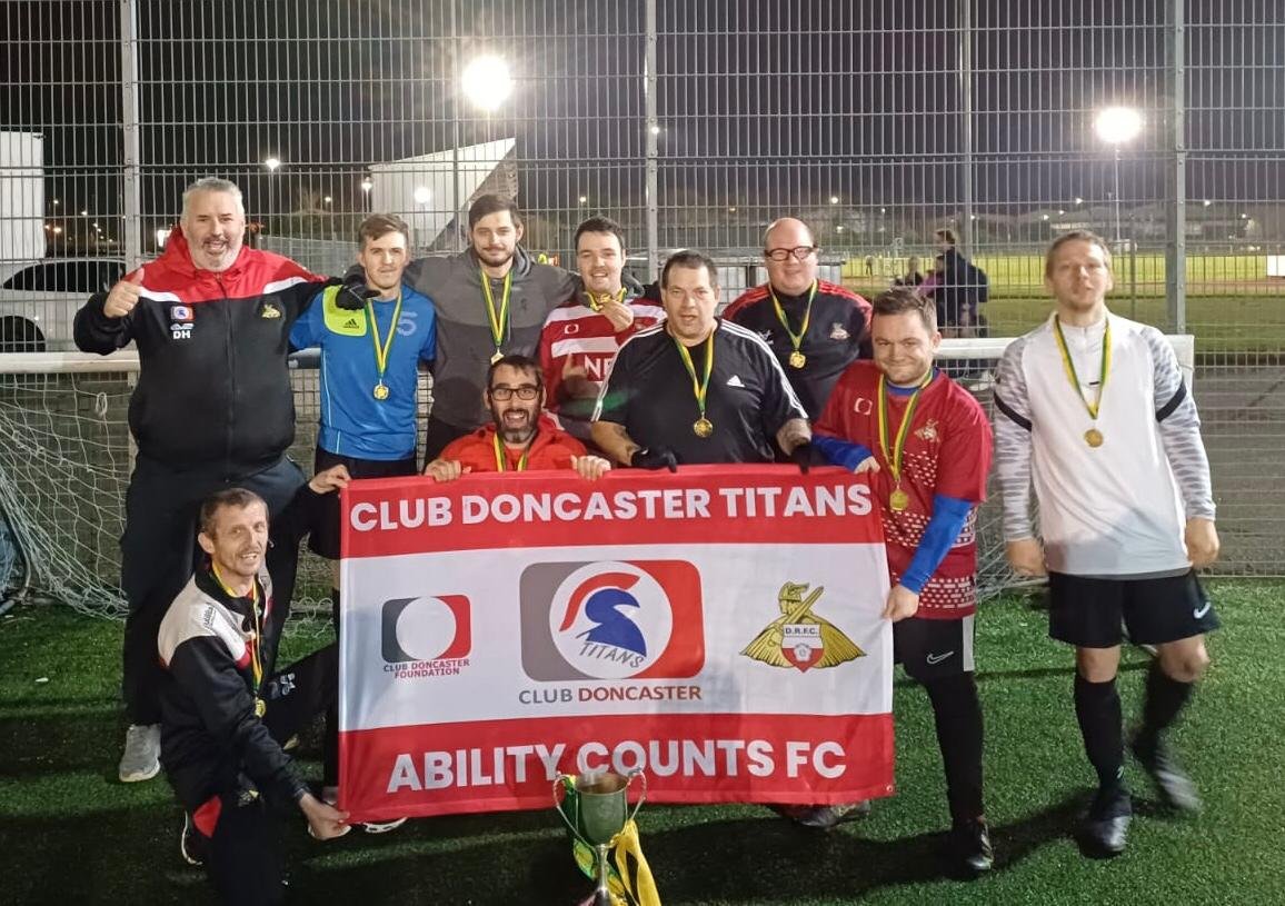 South Yorkshire Ability Counts League (@syorksacl) on Twitter photo Better late than never! <a href="/ClubDTitans/">Club Doncaster Titans</a> ( White) celebrate their <a href="/SYorksACL/">South Yorkshire Ability Counts League</a> Championship title win after that thrilling three-way tie with <a href="/SheffieldFCDT/">Sheffield F.C. Disability</a> & <a href="/StagsAbility/">Mansfield Town Ability Counts FC</a>. Congratulations! <a href="/bcafcdisability/">Bradford City Disability FC</a> <a href="/AcademyDerek/">Derek Dooley Football Academy</a> <a href="/glossopfootball/">Glossop North End Community Club</a> <a href="/RUFC_CT/">Rotherham United Community Trust</a> <a href="/SHCFA/">Sheffield FA ⚽️</a> <a href="/barton_club/">Barton Inclusive Football Club</a> Report on our site Better late than never! <a href="/ClubDTitans/">Club Doncaster Titans</a> ( White) celebrate their <a href="/SYorksACL/">South Yorkshire Ability Counts League</a> Championship title win after that thrilling three-way tie with <a href="/SheffieldFCDT/">Sheffield F.C. Disability</a> & <a href="/StagsAbility/">Mansfield Town Ability Counts FC</a>. Congratulations! <a href="/bcafcdisability/">Bradford City Disability FC</a> <a href="/AcademyDerek/">Derek Dooley Football Academy</a> <a href="/glossopfootball/">Glossop North End Community Club</a> <a href="/RUFC_CT/">Rotherham United Community Trust</a> <a href="/SHCFA/">Sheffield FA ⚽️</a> <a href="/barton_club/">Barton Inclusive Football Club</a> Report on our site