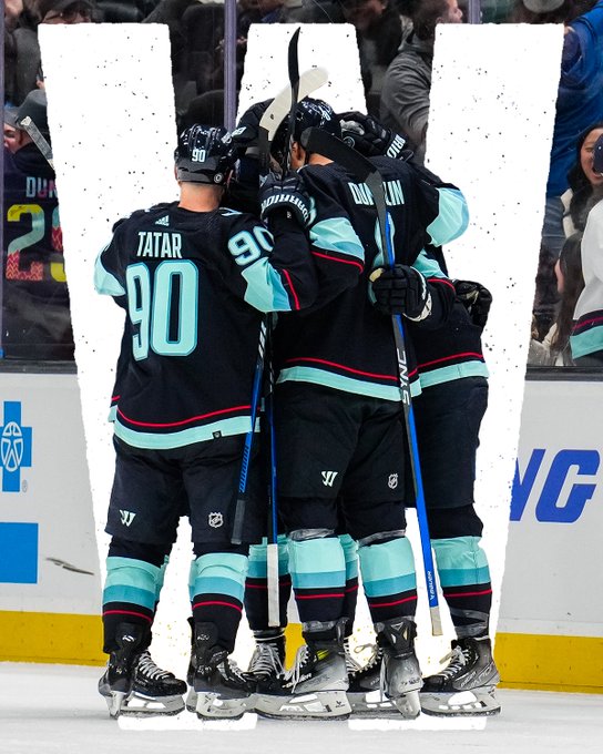 team celly photo with a big W photoshopped in background 